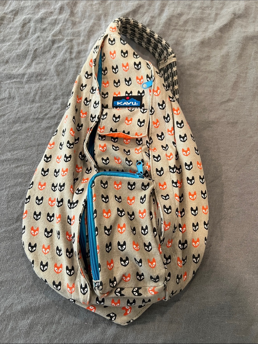 Kavu Beige Sling Bag with Brown & Orange Fox Print and Blue Accents